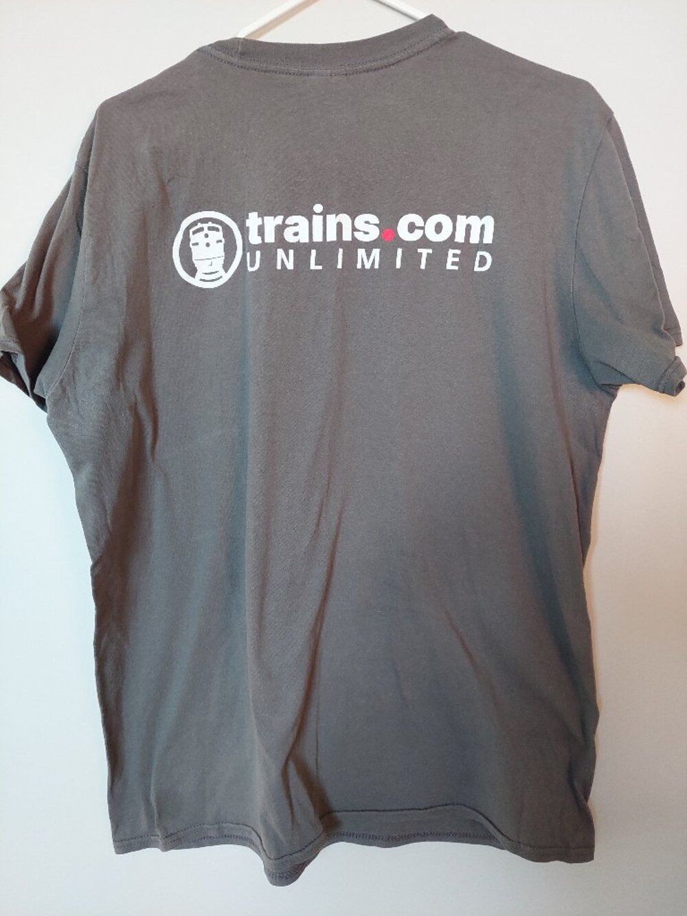 Gildan grey graphic t-shirt featuring the "Trains.com Unlimited" logo on the ch